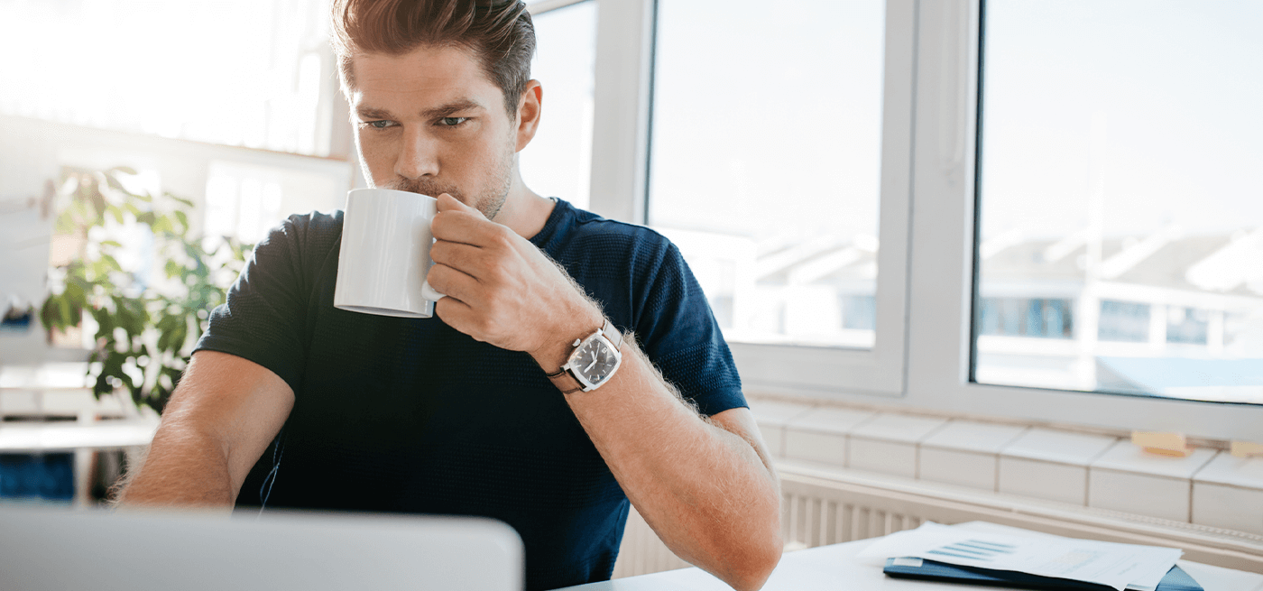 Man drinking a cup of coffee