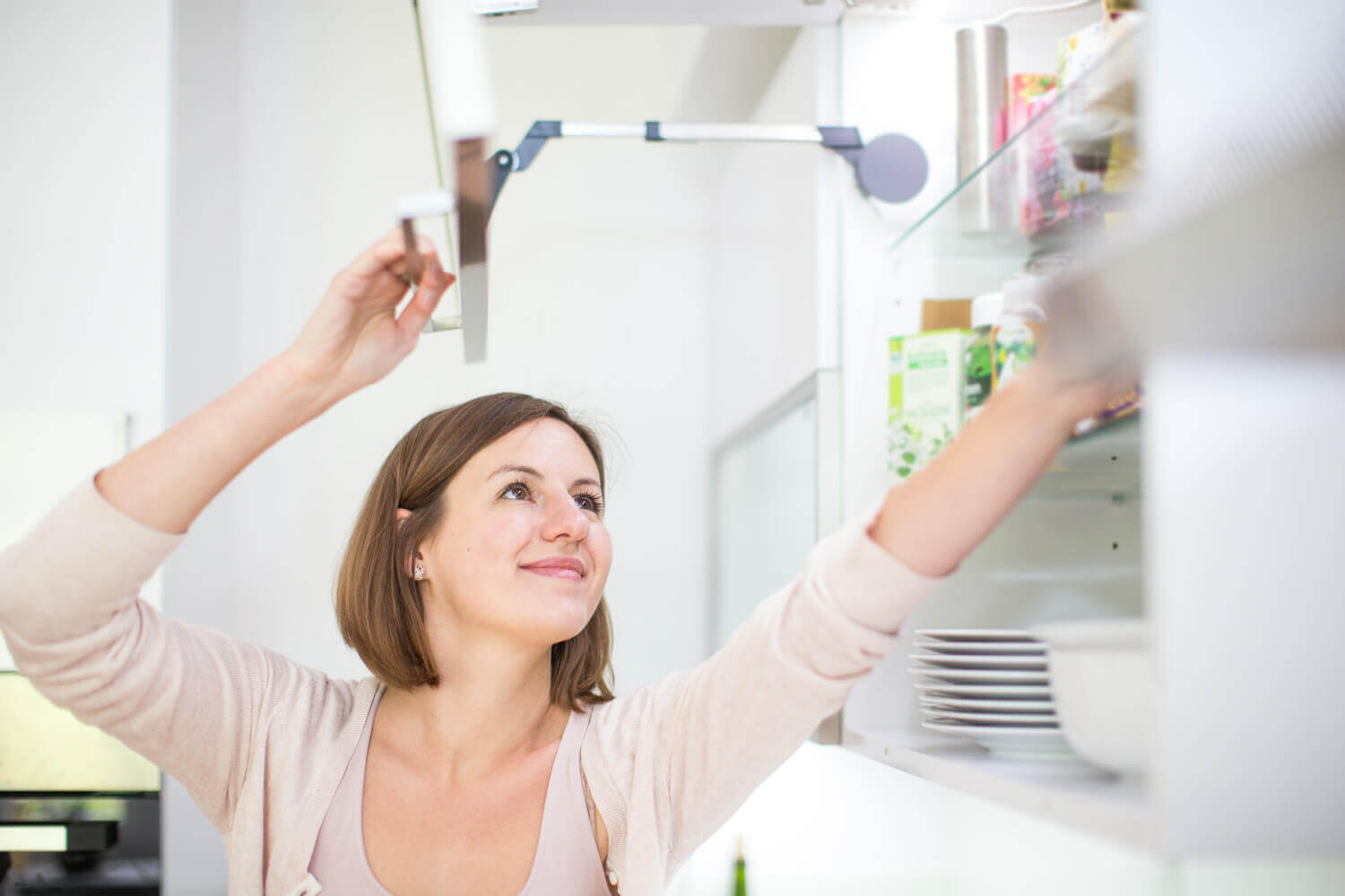 woman organizing kitchen woman organizing kitchen
