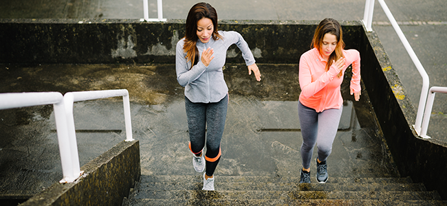 2 women running up stairs