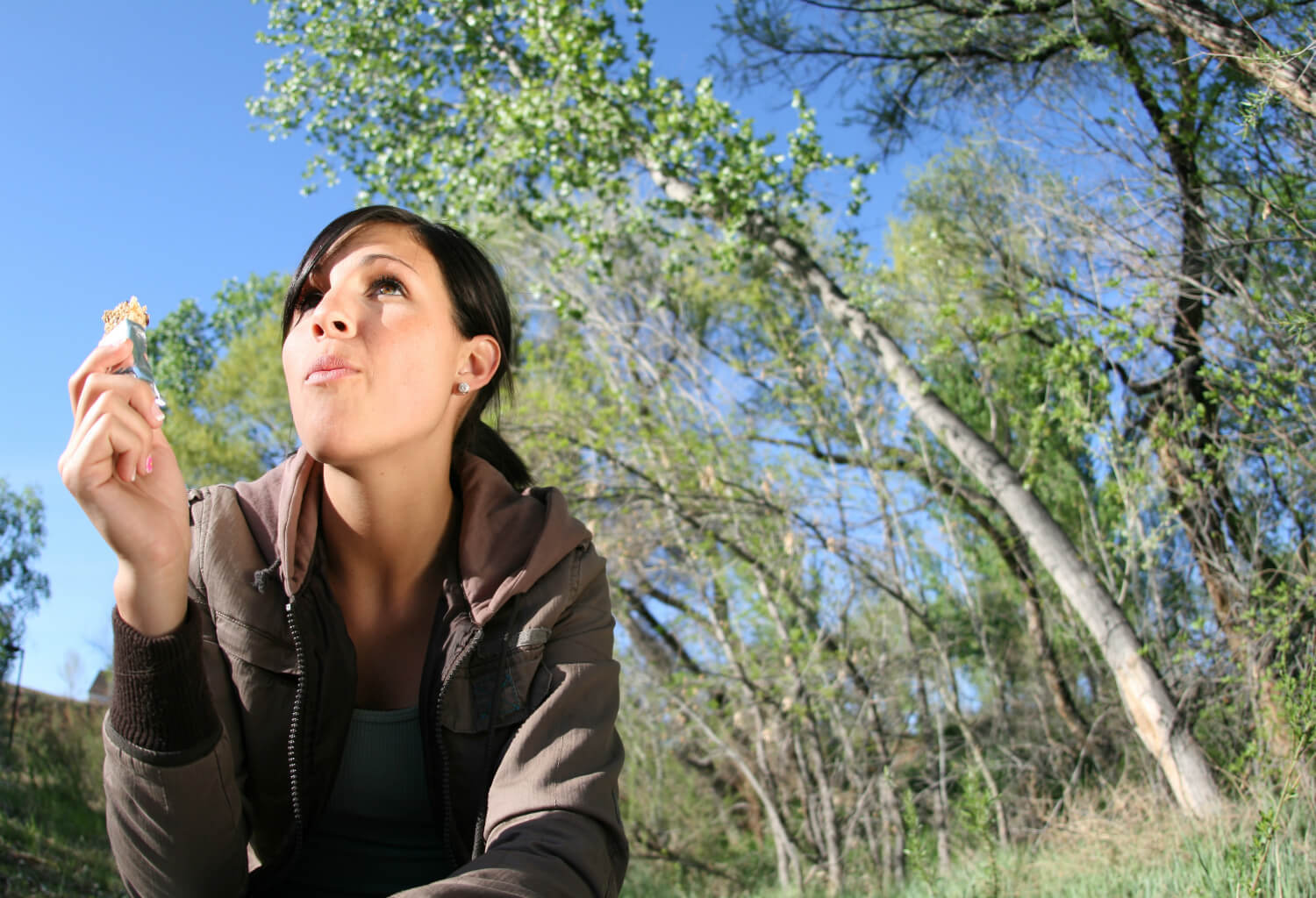 woman eating snack bar